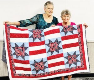 Nutrition Center selling tickets for patriotic quilt drawing