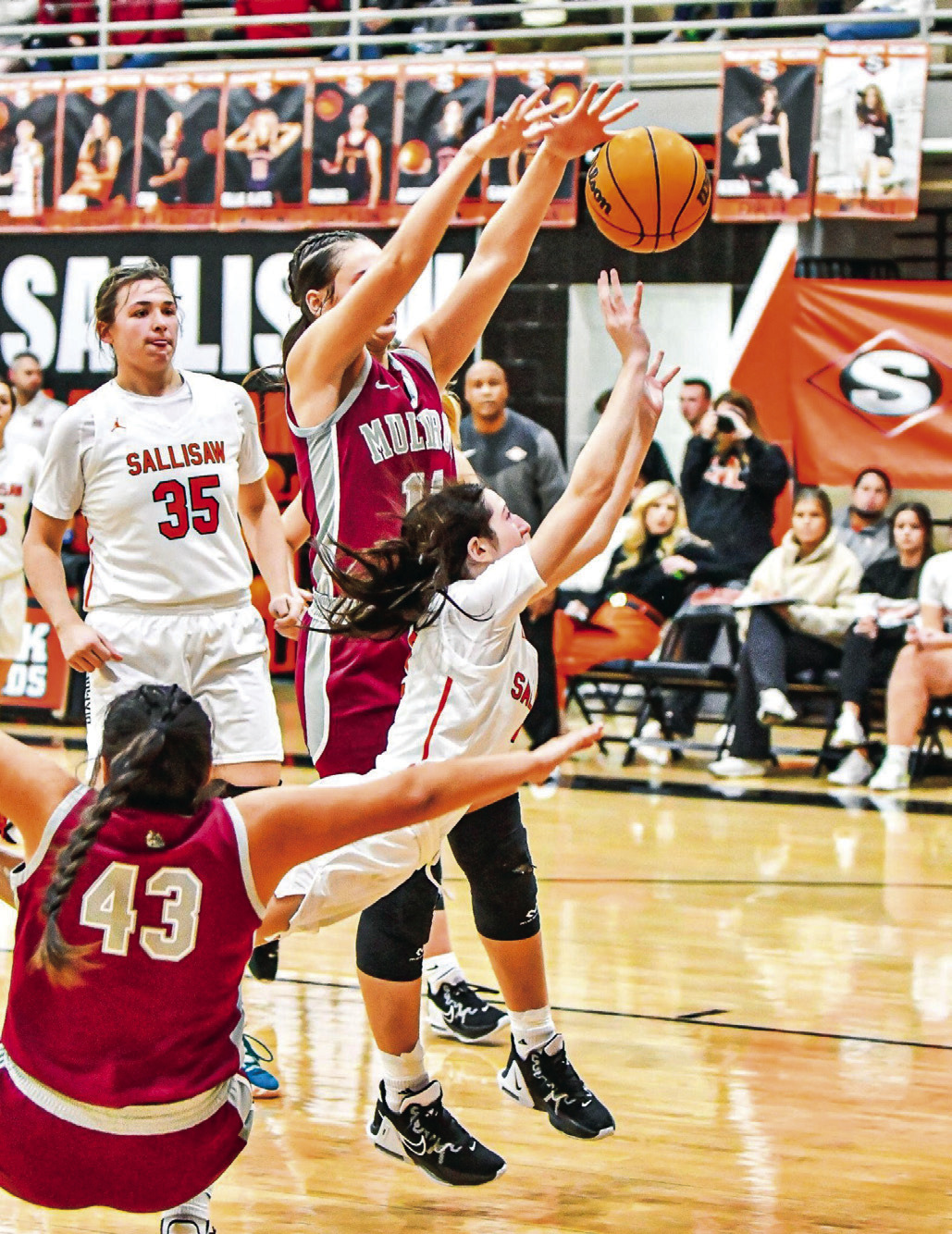 Sallisaw sophomore Kayli Macon (2) draws the foul while driving to the basket through two Muldrow defenders as Addyson Gream (35) looks on at Paul Post Fieldhouse during Friday’s 4630 loss to the Lady Bulldogs. JIM CAMERON •TIMES