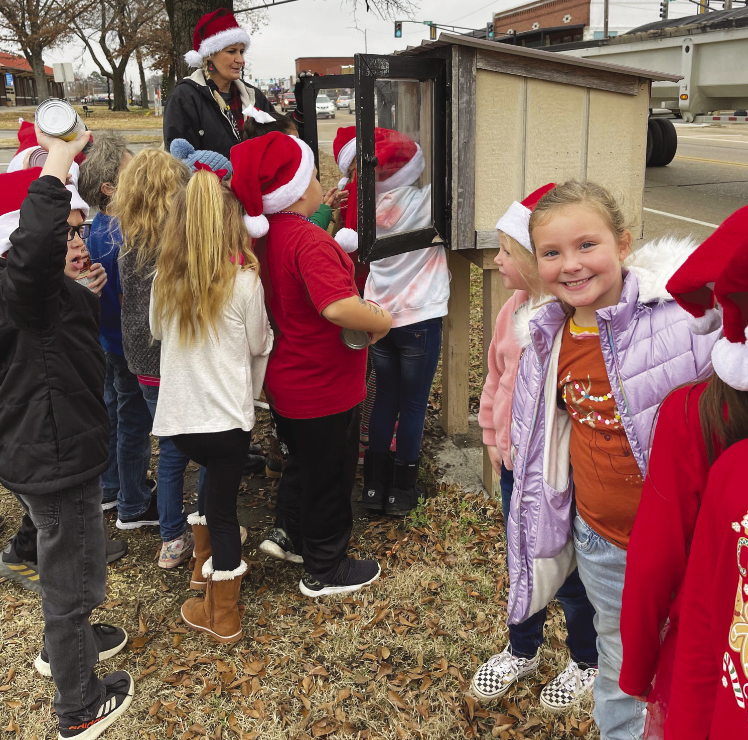 First and second grade students form Central Elementary School recently filled the blessing box at the Stanley Tubbs Memorial Library in Sallisaw, and also sang Christmas carols at nurse Vickie Hodges’ house. The students had a wonderful time spreading holiday cheer! PHOTOS BY COURTNEY BARKER