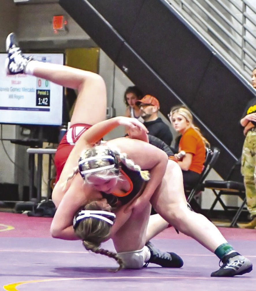 Hannah Lightfoot of Sallisaw pinned Lizzy Peterson from Owasso in her final to qualify for the OSSAA State Tournament. Lightfoot finished third for the Sallisaw girls wrestling team. JIM CAMERON • TIMES