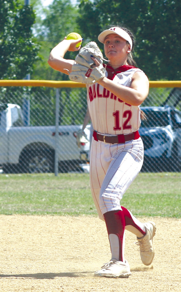 Muldrow shortstop Lani Israel throws to first base during Tuesday’s 5A-11 slowpitch district tournament at Muldrow. The Lady Bulldogs topped Sallisaw 10-0 in the title game to advance to next week’s regional tournament. LEA LESSLEY • TIMES
