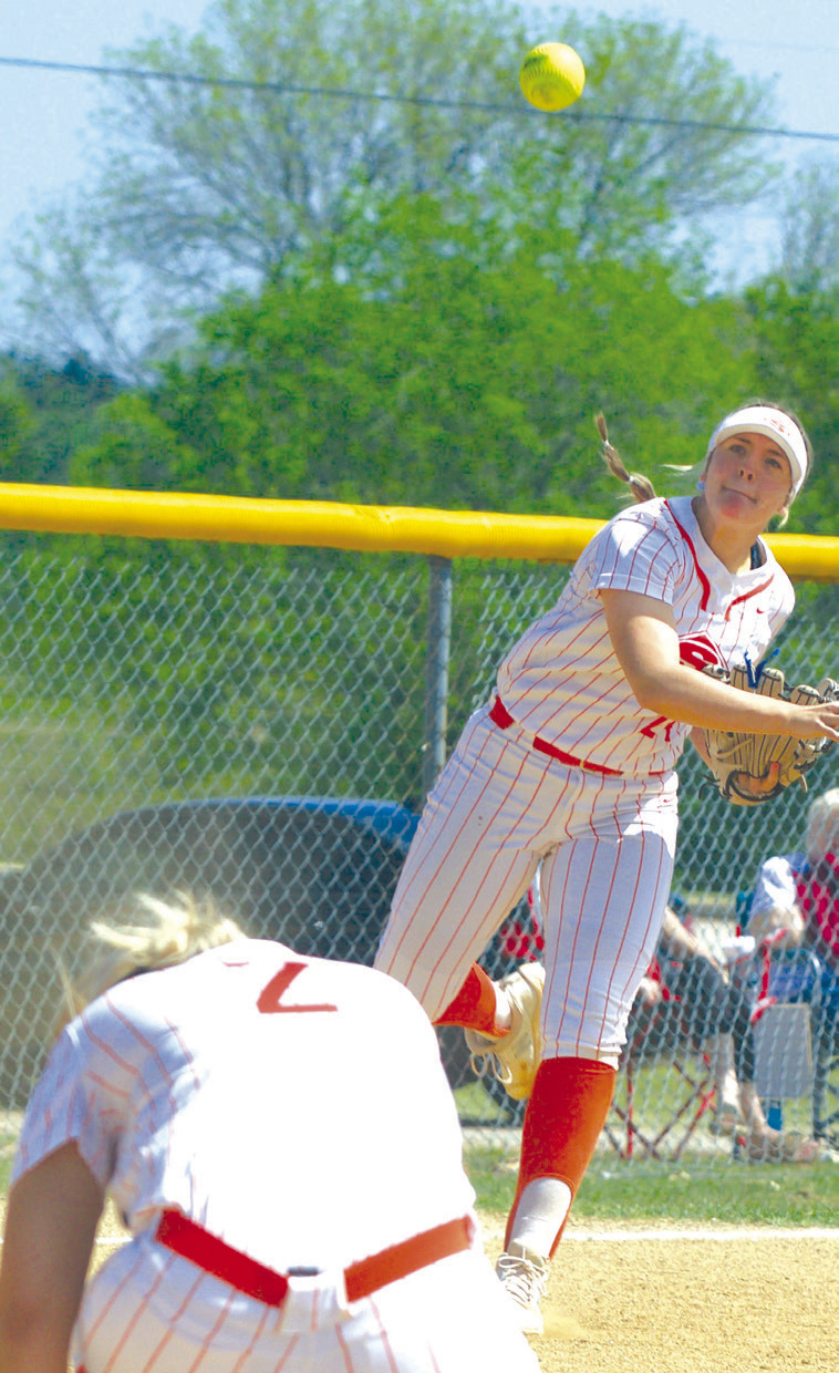 Sallisaw third baseman Emily Gregory throws to first base during Tuesday’s 5A-11 slowpitch district tournament at Muldrow as pitcher Cambree Scott crouches down. The Lady Diamonds beat Checotah 14-8 in their tournament opener but a pair of losses (9-1 and 10-0) to Muldrow ended their season. LEA LESSLEY • TIMES