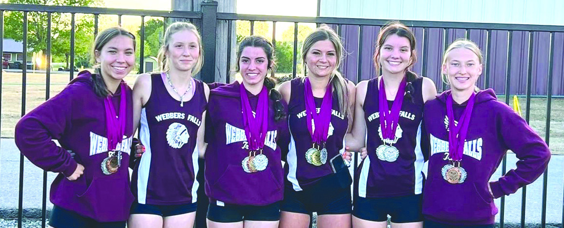 The Webbers Falls girls’ high school track and field team participated in the Warner Twilight Meet last Friday. Members of the team are (from left) Bridgette Baer, Audri Spears, Anistyn Garner, Teralynn Colston, Abby Pense and Cheyanne Herrier. Webbers Falls will journey to Okemah Saturday for it Class A regional meet. PHOTO SUBMITTED BY JORDAN GARNER